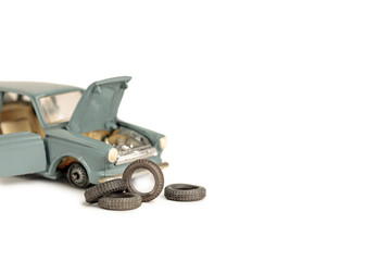 toy car with removed tires, tire and car repair service