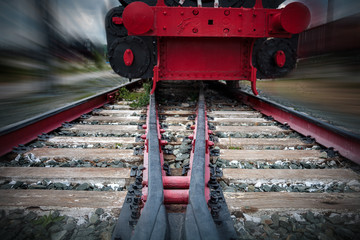 rails for trains close-up selective focus, against the background of the train coming towards,...