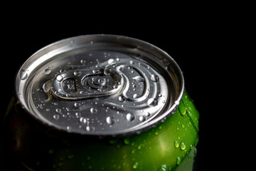 aluminum soda and beer beverage can with water droplets isolated on dark background, metal can, recyclable product