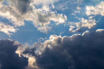 the sun shining through the clouds against the blue sky, light clouds in the sky