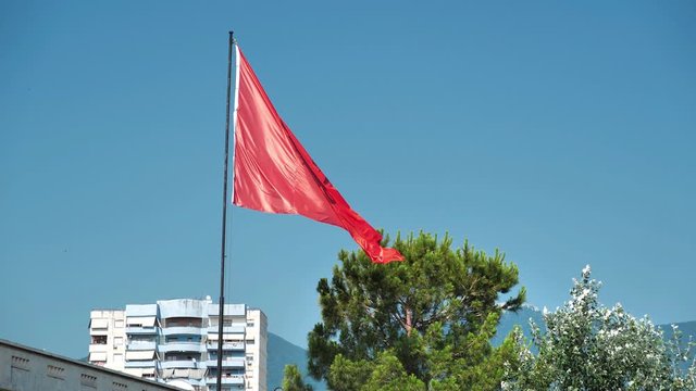 Slow motion, national flag of Albania. Red flag with silhouetted black double-headed eagle