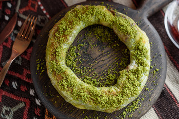 Traditional Turkish Pastry Dessert with Clotted Cream and Pistachios, Simit Katmer