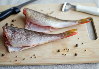 Just cleaned perch fish on the cutting board