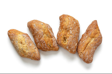 Four freshly baked buns, with a crisp crust, isolated on a white backdrop