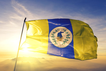 Itapipoca of Brazil flag waving on the top sunrise mist fog