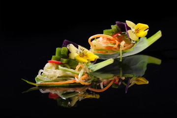 juicy vegetable snacks on a black background