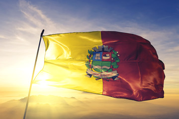 Mogi Guacu of Brazil flag waving on the top sunrise mist fog