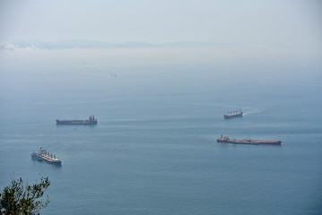 Cargo ships waiting for their turn in the bay of Gibraltar.  Logistics in the Mediterranean Sea.