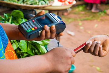 holding a pos machince and receiving of credit card in a market