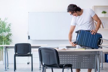 Young male student in front of whiteboard