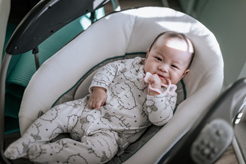 Little 5 months baby boy playing at home