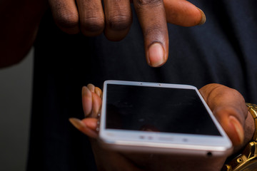 finger about to touch the screen of a phone.