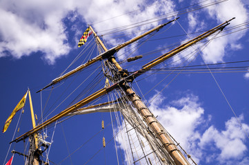 Mast, rigging and flags of a classic sailing ship.