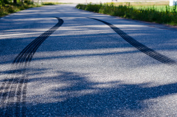 Skidmarks on a narrow road