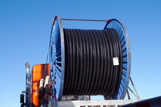 truck transporting electric wire spool large roll coil