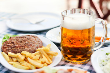 Burger Fries and Beer in a Glass Mug