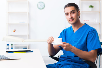 Young male doctor working in the clinic