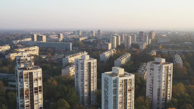 Croatia, city of Zagreb, sunset over residential towers of Novi Zagreb socialist district in autumn day, drone footage