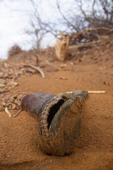 Close up in a wasted boot with a hole in a drought region