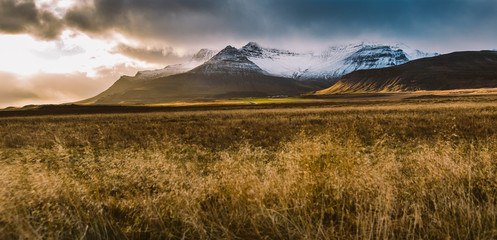 High Icelandic or Scottish mountain landscape with high peaks and dramatic colors
