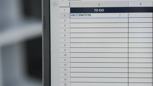Person marking task VACCINATION in online plan, to-do list