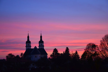 Fototapeta na wymiar church against the sky at sunset