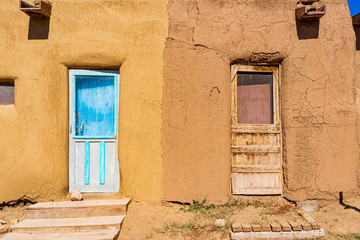 Two doors in the wall, one used and one neglected