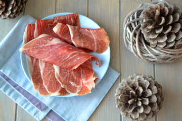 The marble ham from the pig is the Pata Negra. Spanish cuisine. Top view with spanish cones