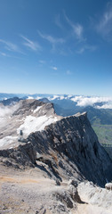 Jagged peaks of mountain with summer snow