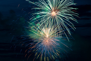 Festive beautiful fireworks in the sky. Celebrating the holiday with a bright salute