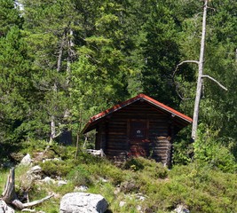 Small wood cabin on island in Lake Eibsee