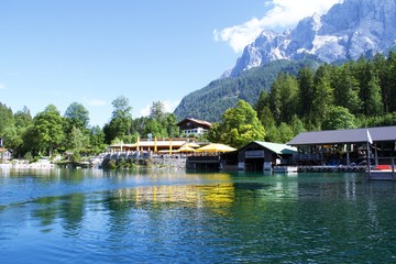 Fototapeta na wymiar View of Eibsee is a lake in Bavaria, Germany, with buildings on the bank