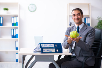 Young male accountant working in the office