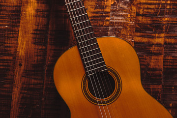 Shot of Classical Guitar on a Rustic Wooden Table