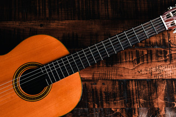 Fototapeta na wymiar Shot of Classical Guitar on a Rustic Wooden Table