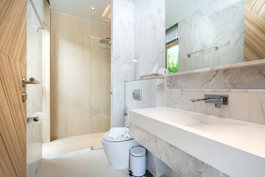 interior real bathroom features basin and toilet bowl