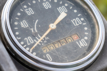 Retro motorcycle black analog speedometer close up