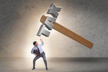 Businessman under the burden of tax payments
