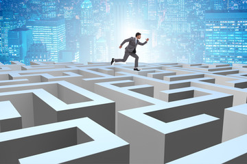 Businessman trying to escape from maze