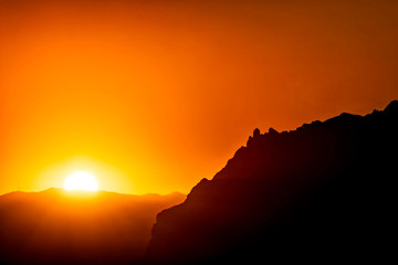 Sunset in the Mountains with Silhouetted Peak 