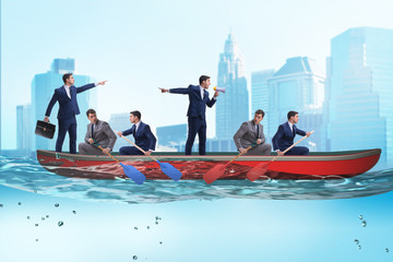 Disagreement concept with businessmen rowing in different direct © Elnur