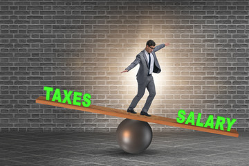 Businessman balancing between taxes and salary