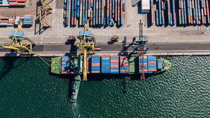 Aerial view of cargo ship, cargo container in warehouse harbor at thailand .