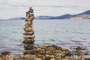 pebbles and rocks in relaxing zen inspiring stack on the beach in Australia