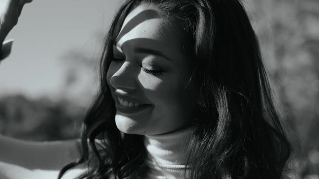 Young adult lady with smiling face having fun outdoor