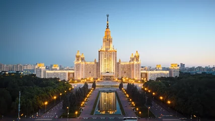 Washable wall murals Moscow Motion of Moscow State University in the evening, aerial view. Camera moving towards MSU, showing also its alleys and outdoor lighting gradually turning on.