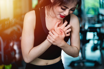 Woman injury pain chest attack heart after workout training exercise