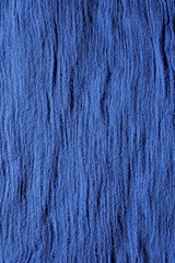 Blue fabric mesh. Rumpled cloth background.