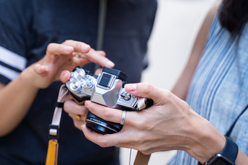 woman teaching how to use camera
