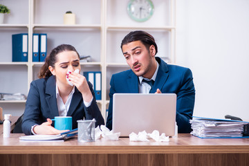 Two employees suffering at workplace